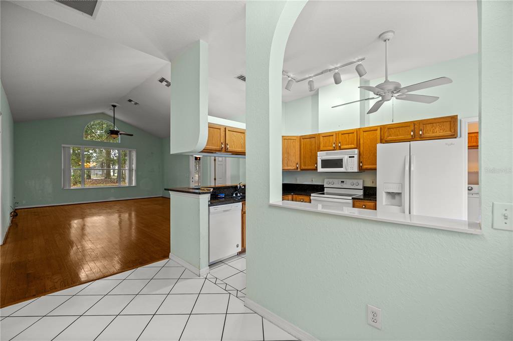 10891 Southwest 69th Circle Ocala, FL 34476 - Photo 9 of 28 a kitchen with stainless steel appliances a refrigerator sink and microwave