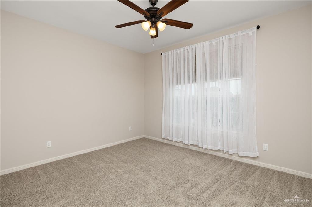14213 Gorman Fls Road McAllen, TX 78504 - Photo 11 of 13 a view of an empty room with a window