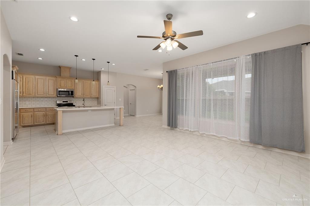 14213 Gorman Fls Road McAllen, TX 78504 - Photo 2 of 13 a view of a kitchen with a sink and stainless steel appliances