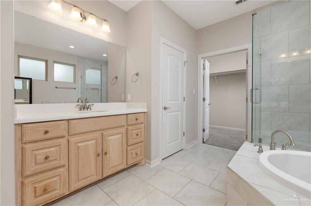 14213 Gorman Fls Road McAllen, TX 78504 - Photo 7 of 13 a spacious bathroom with a double vanity sink mirror and double