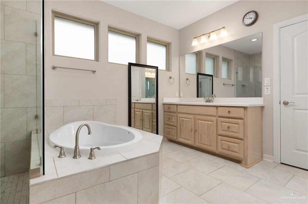 14213 Gorman Fls Road McAllen, TX 78504 - Photo 8 of 13 a bathroom with a bathtub and a sink