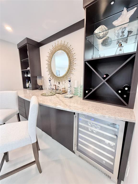 1050 Longboat Club Road, Unit 803 Longboat Key, FL 34228 - Photo 11 of 39 a kitchen with a refrigerator and a stove