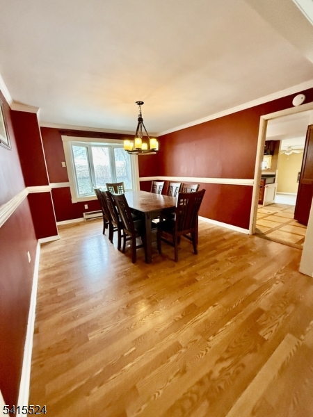 150 Karrville Road Port Murray, NJ 07865 - Photo 9 of 40 a view of a dining room with furniture and wooden floor
