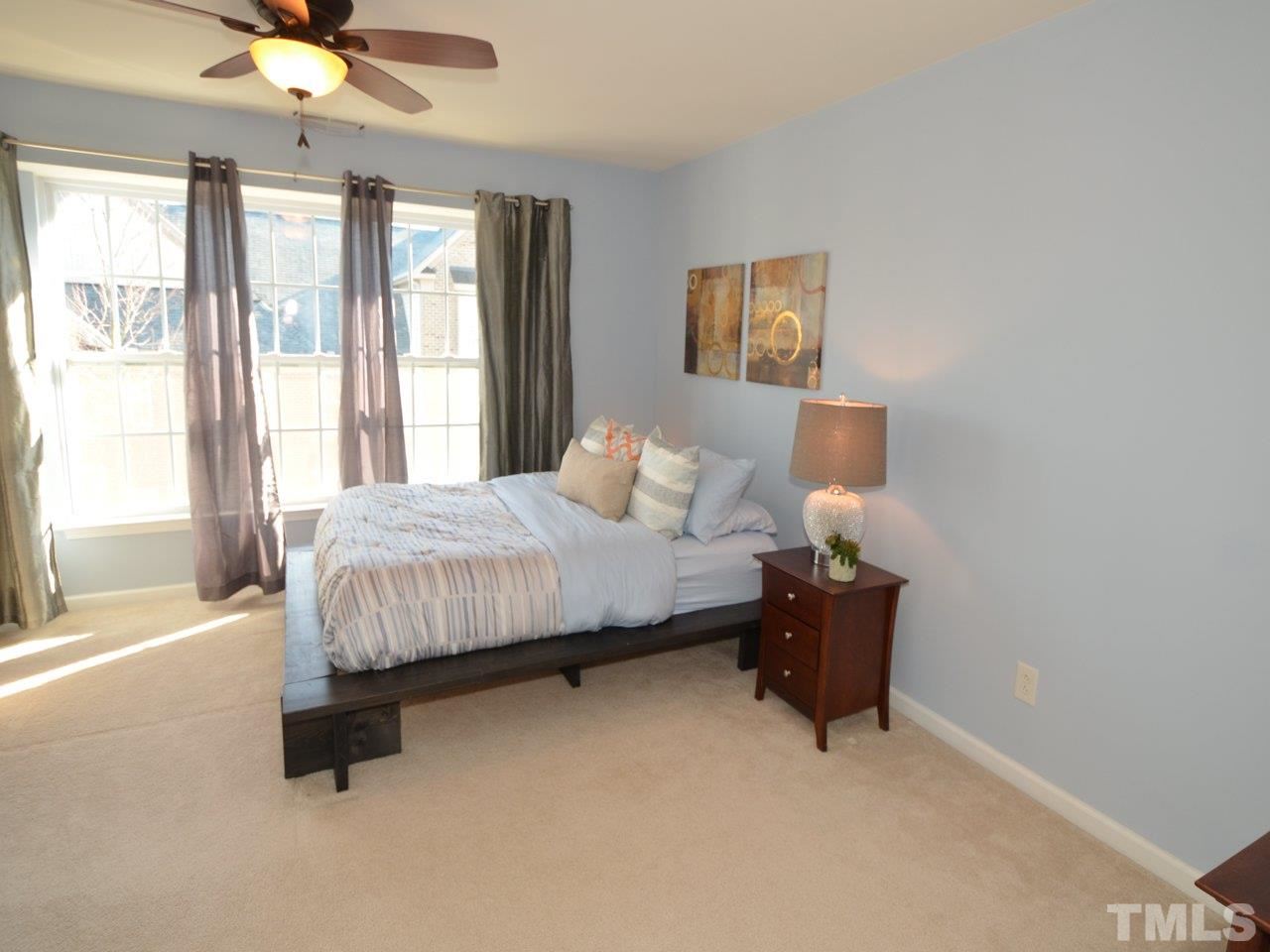 9705 Raya Court Raleigh, NC 27617 - Photo 11 of 25 a bedroom with a bed and window
