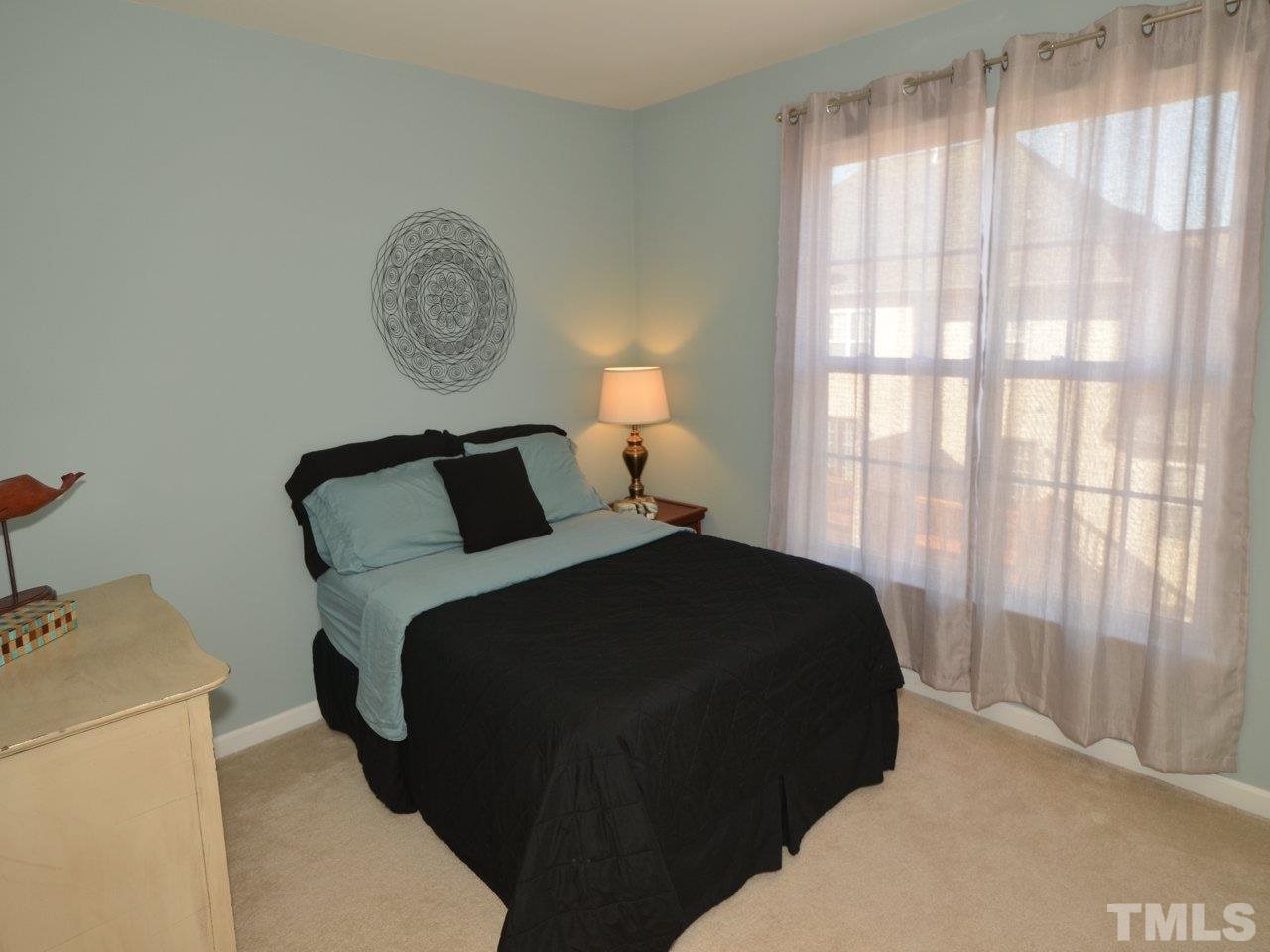 9705 Raya Court Raleigh, NC 27617 - Photo 16 of 25 a bedroom with a bed and a closet