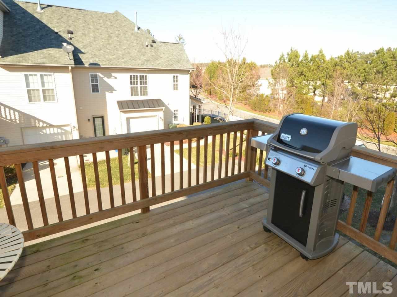 9705 Raya Court Raleigh, NC 27617 - Photo 22 of 25 a view of a balcony with wooden floor and fence