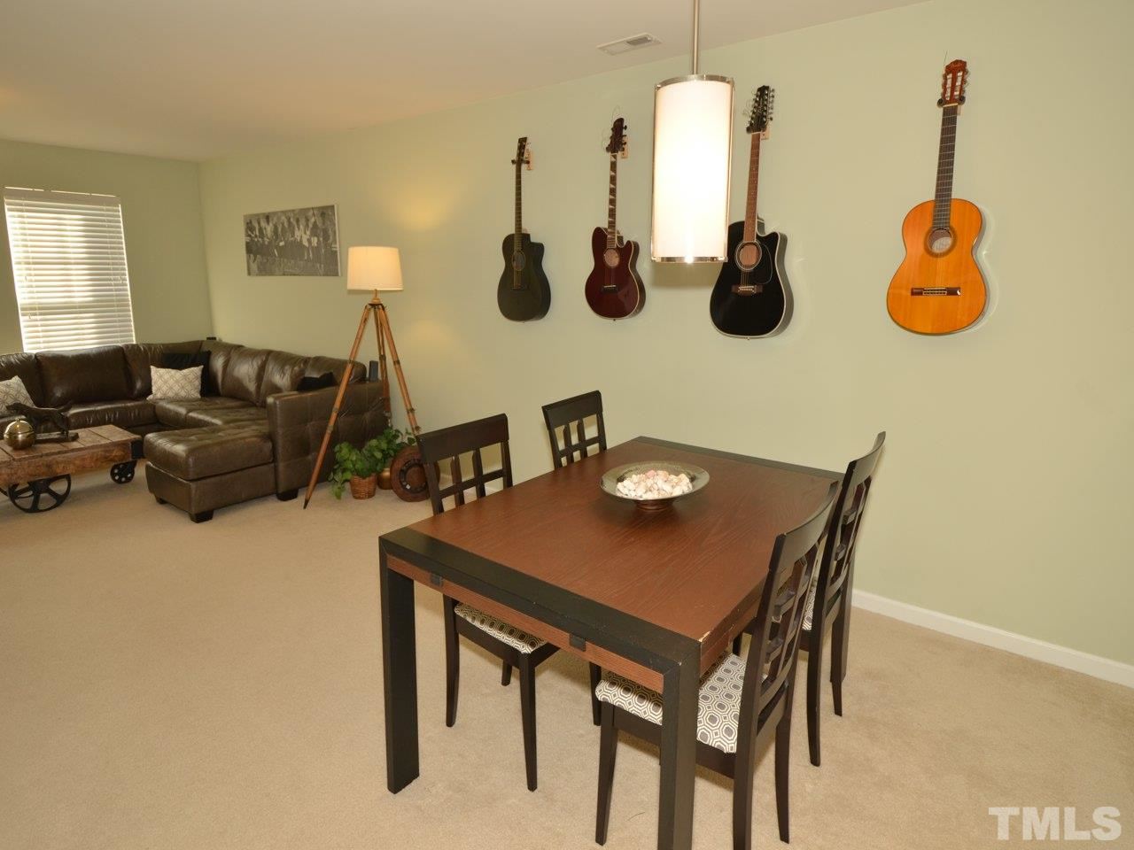 9705 Raya Court Raleigh, NC 27617 - Photo 6 of 25 a view of livingroom and dining room with furniture