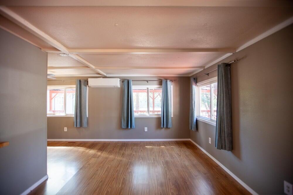 4778 North River Road Gold Hill, OR 97525 - Photo 6 of 15 a view of livingroom with hardwood floor and window