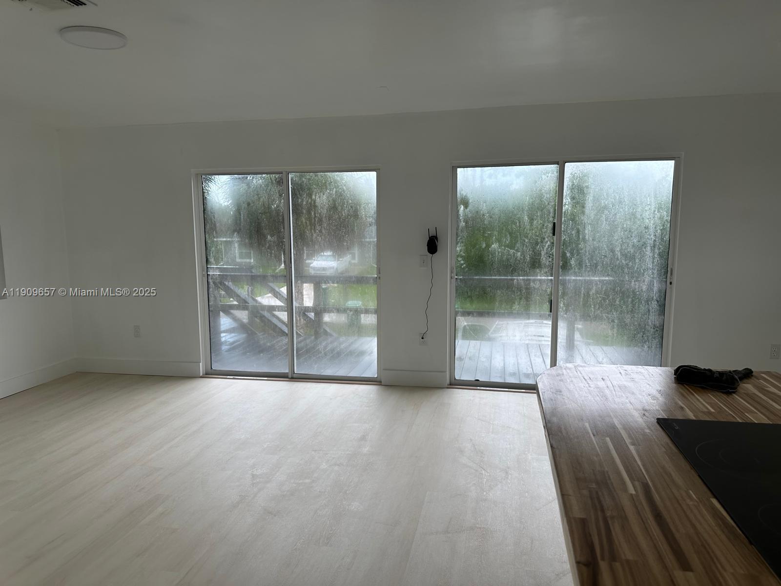 420 Burning Tree Lane, Unit 420 Punta Gorda, FL 33982 - Photo 1 of 19 a view of a big room with windows and wooden floor