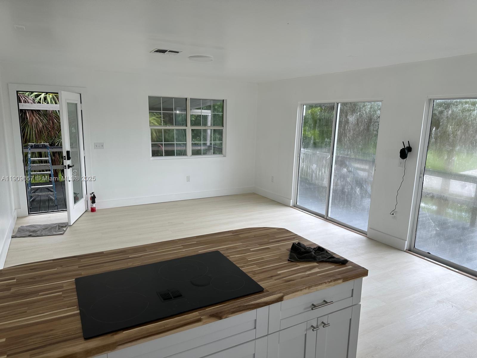 420 Burning Tree Lane, Unit 420 Punta Gorda, FL 33982 - Photo 11 of 19 a kitchen with granite countertop white cabinets and a stove