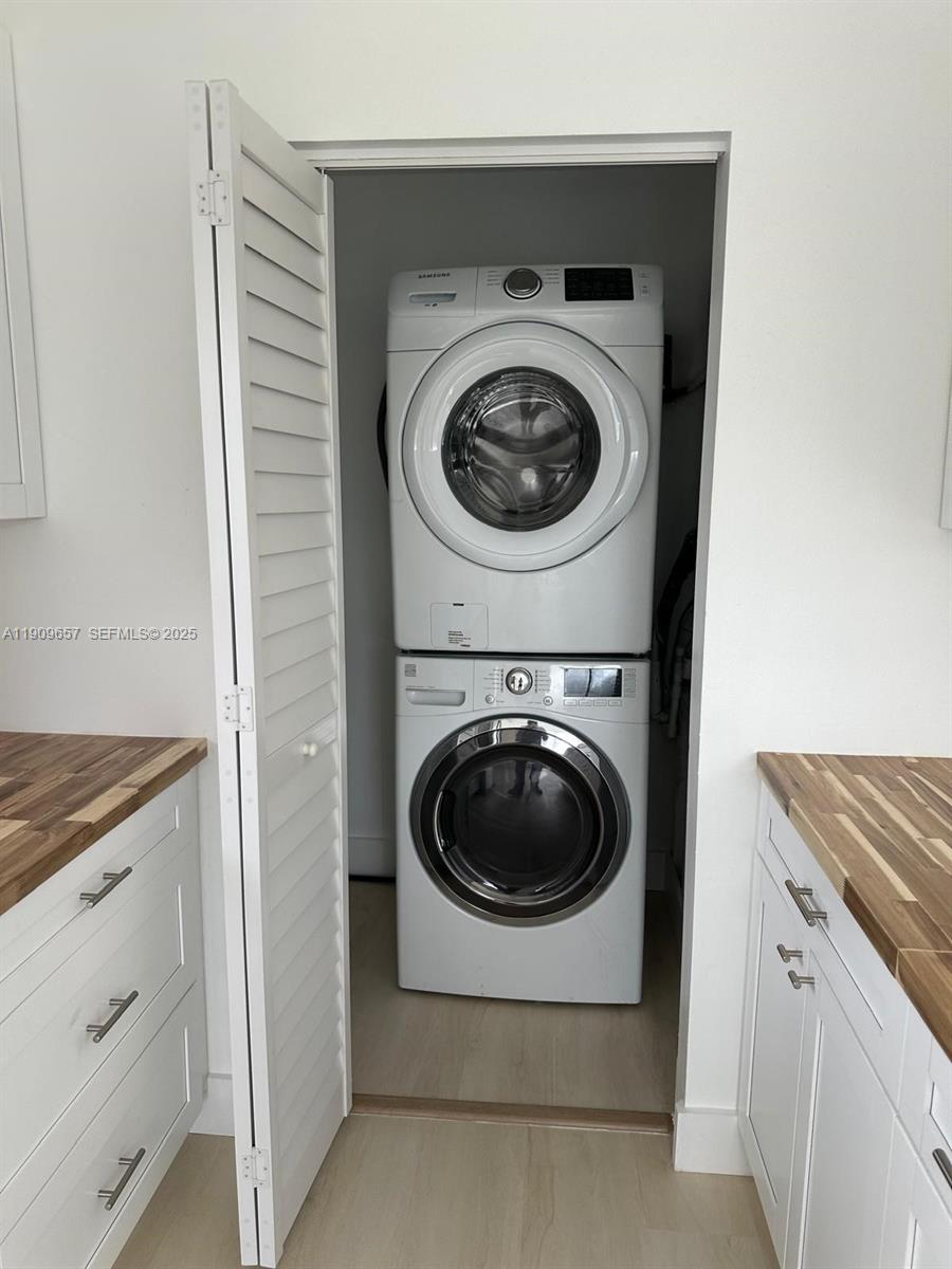 420 Burning Tree Lane, Unit 420 Punta Gorda, FL 33982 - Photo 12 of 19 a utility room with dryer and washer