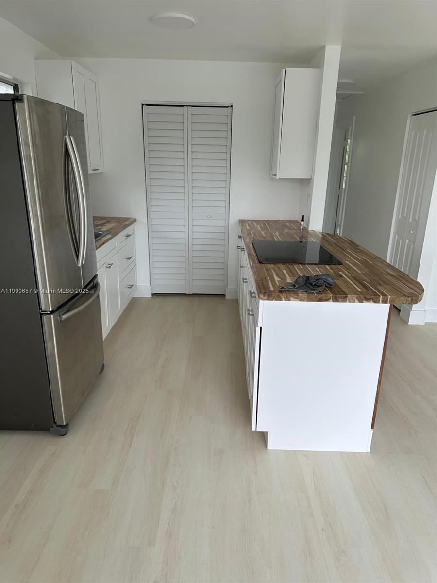 420 Burning Tree Lane, Unit 420 Punta Gorda, FL 33982 - Photo 13 of 19 a kitchen with stainless steel appliances granite countertop a sink stove and refrigerator