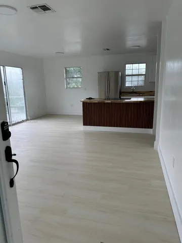 a view of balcony with wooden floor