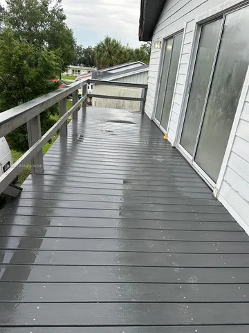 a view of a big yard with wooden floor