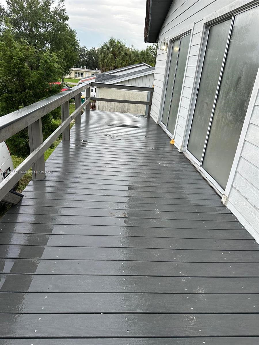 420 Burning Tree Lane, Unit 420 Punta Gorda, FL 33982 - Photo 18 of 19 a view of balcony with wooden floor