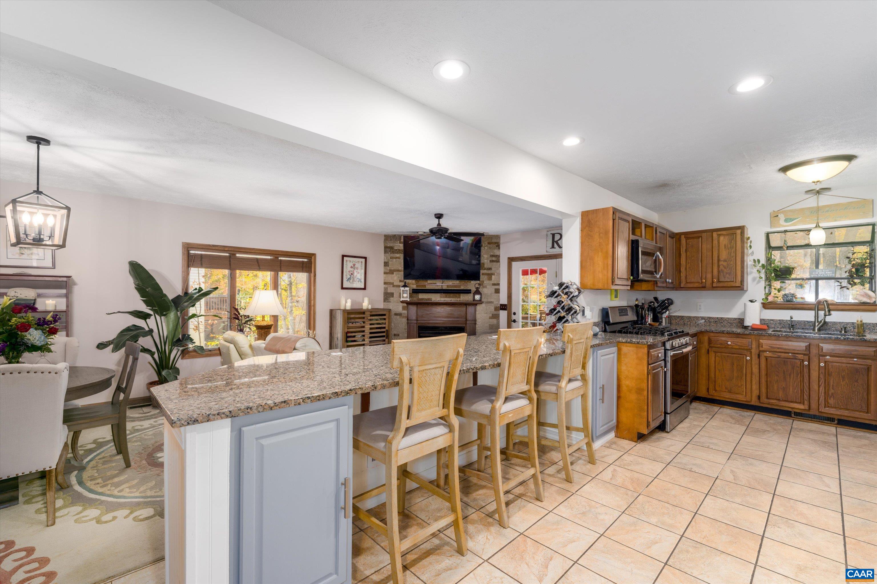 41 Dogleg Road Palmyra, VA 22963 - Photo 13 of 47 a kitchen with stainless steel appliances kitchen island granite countertop a sink and cabinets