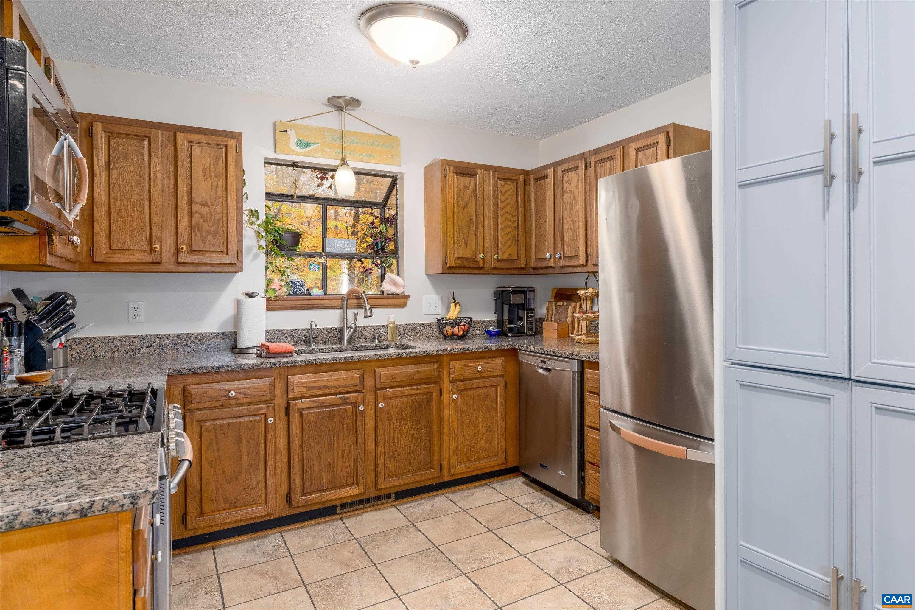 41 Dogleg Road Palmyra, VA 22963 - Photo 16 of 47 a kitchen with stainless steel appliances granite countertop a refrigerator sink and microwave