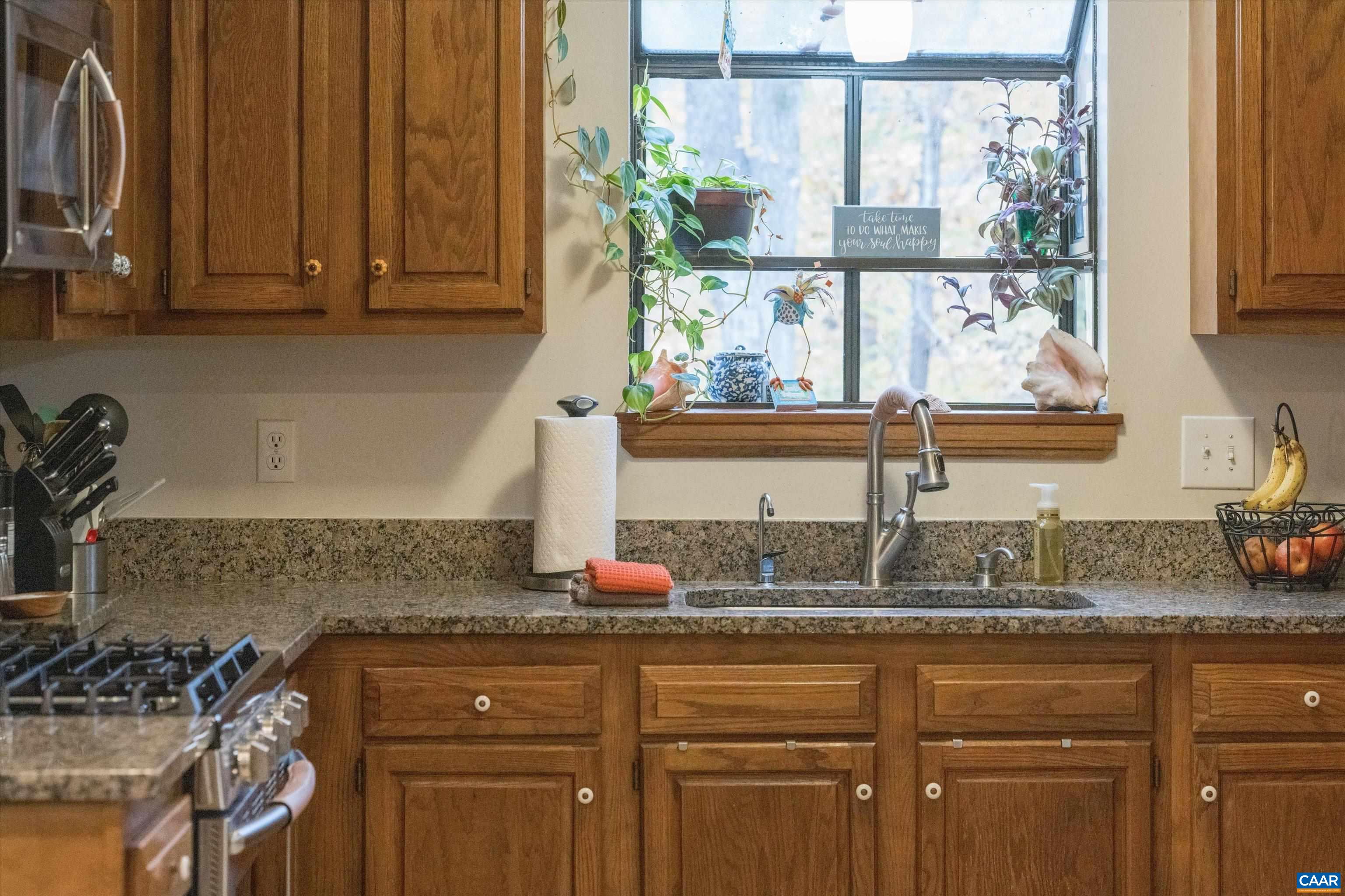 41 Dogleg Road Palmyra, VA 22963 - Photo 17 of 47 a kitchen with granite countertop a sink and a window
