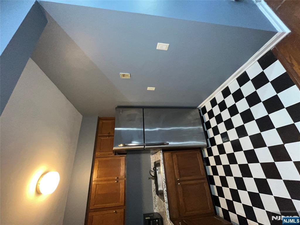 565 Grove, Unit B12 Clifton, NJ 07013 - Photo 17 of 19 a black and white checkered floor with a black white checkered floor