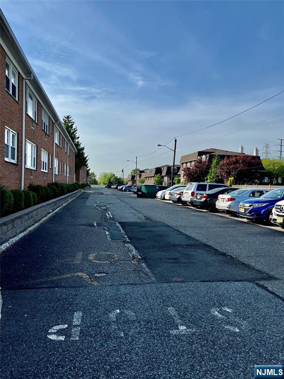 565 Grove, Unit B12 Clifton, NJ 07013 - Photo 3 of 19 a car parked on the side of the road