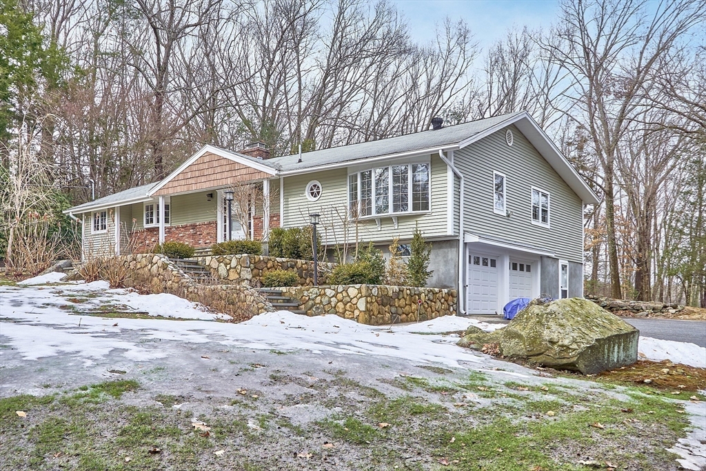 52 Gray Road Andover, MA 01810 - Photo 3 of 42 a front view of a house with a yard covered in snow
