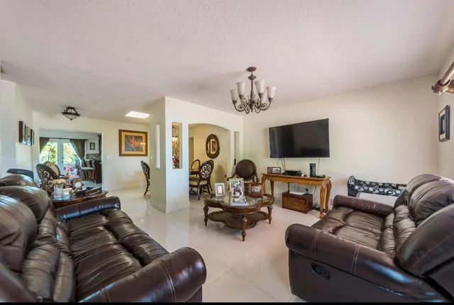 a living room with furniture and a chair