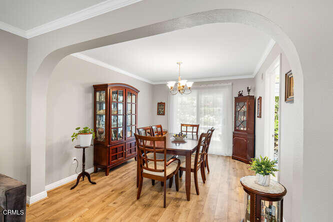 19721 Turtle Springs Way Porter Ranch, CA 91326 - Photo 8 of 42 a view of a dining room with furniture and window