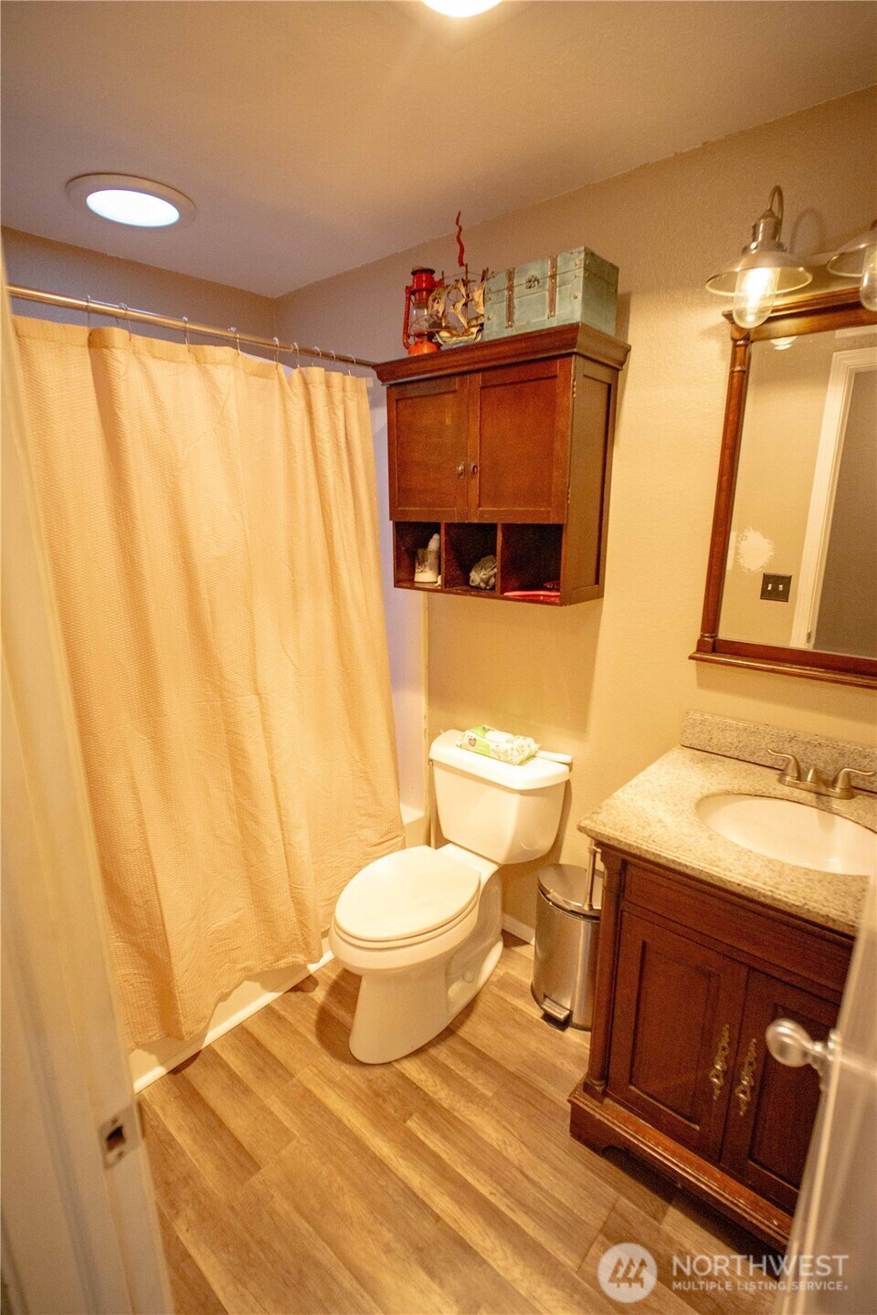 151 Valley View Drive Sequim, WA 98382 - Photo 28 of 40 a bathroom with a sink a toilet and a mirror