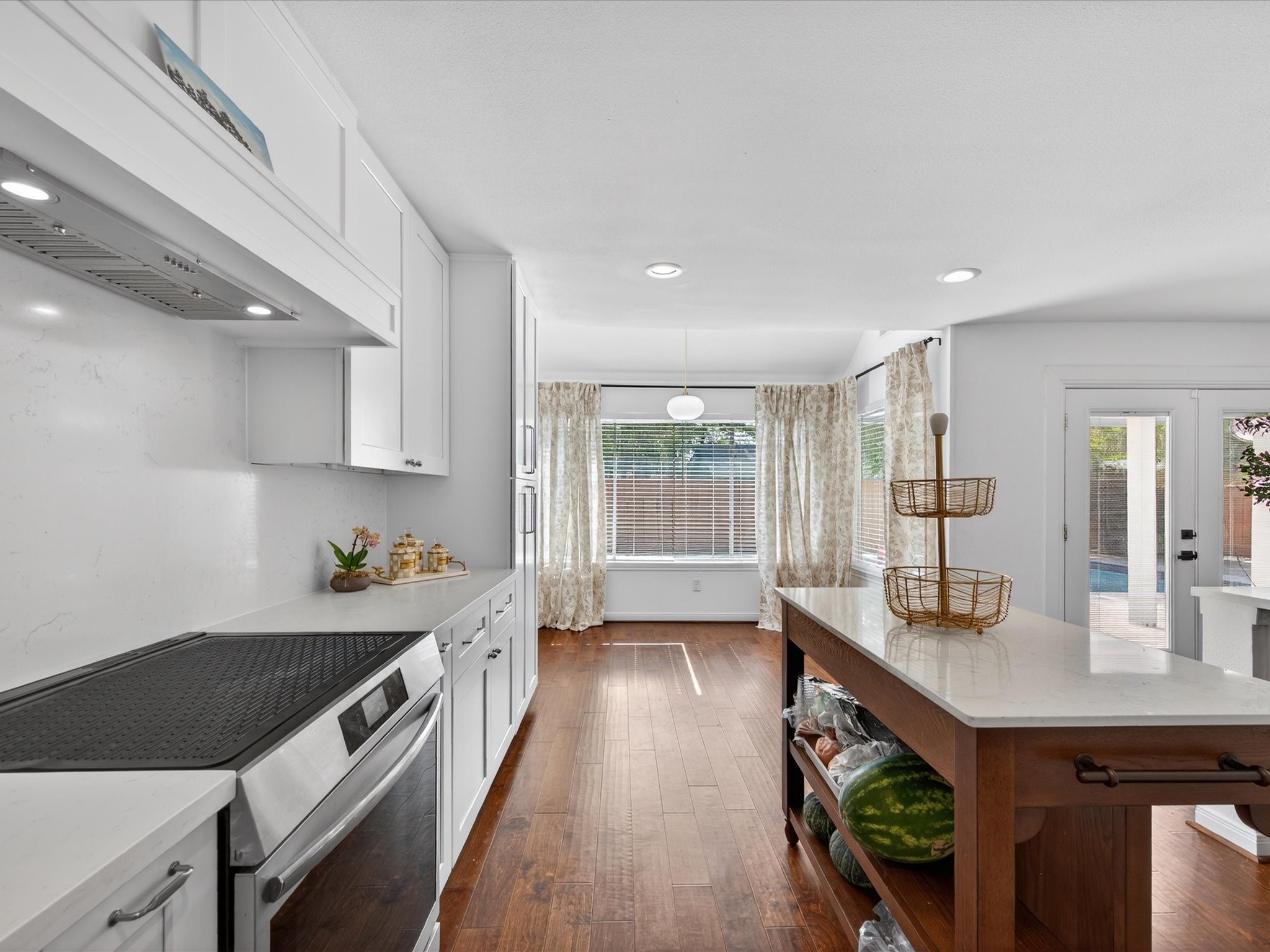 1676 Beaconshire Houston, TX 77077 - Photo 12 of 28 a kitchen with a sink stove and cabinets