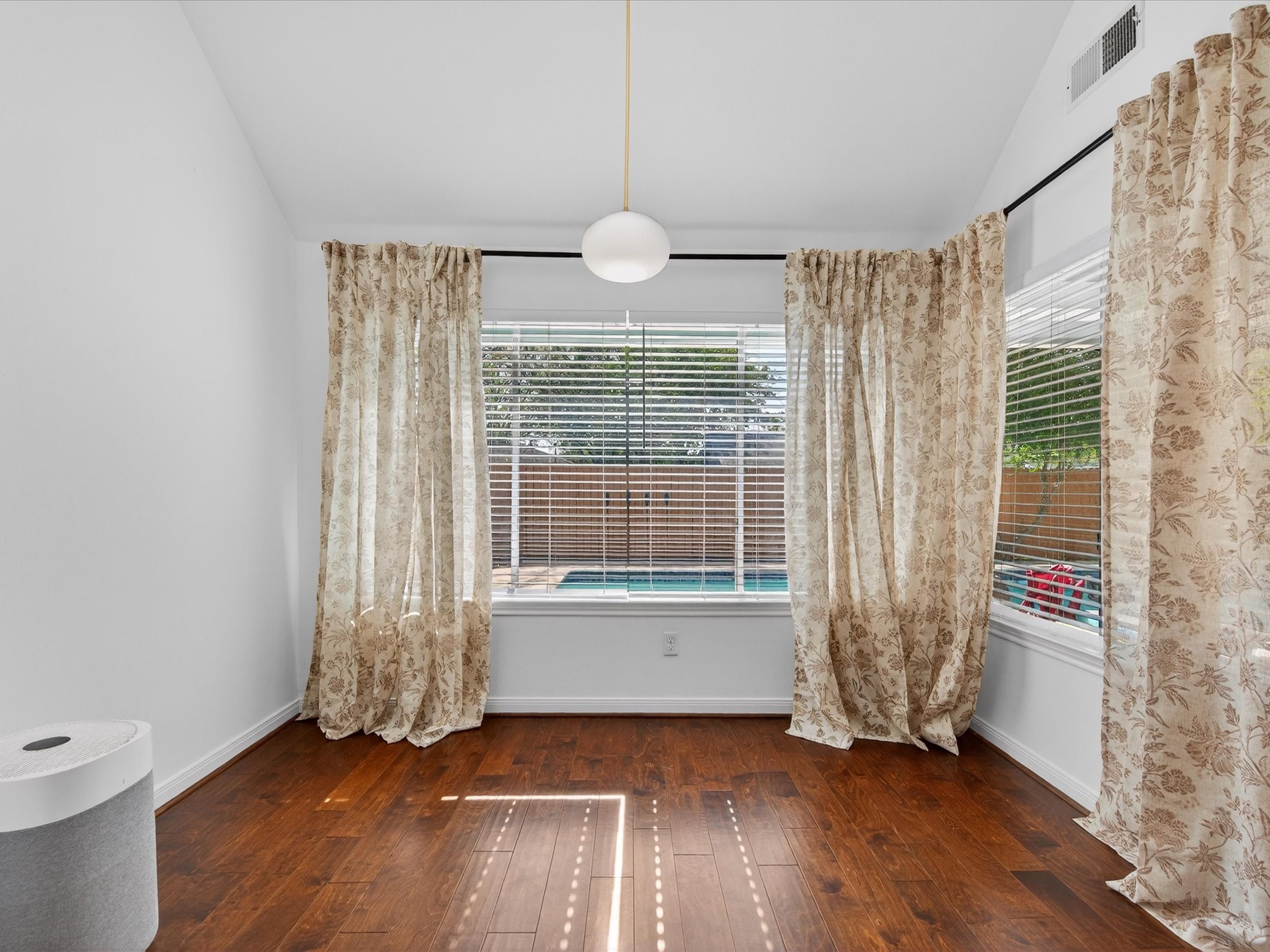 1676 Beaconshire Houston, TX 77077 - Photo 14 of 28 a view of an empty room with wooden floor and a window