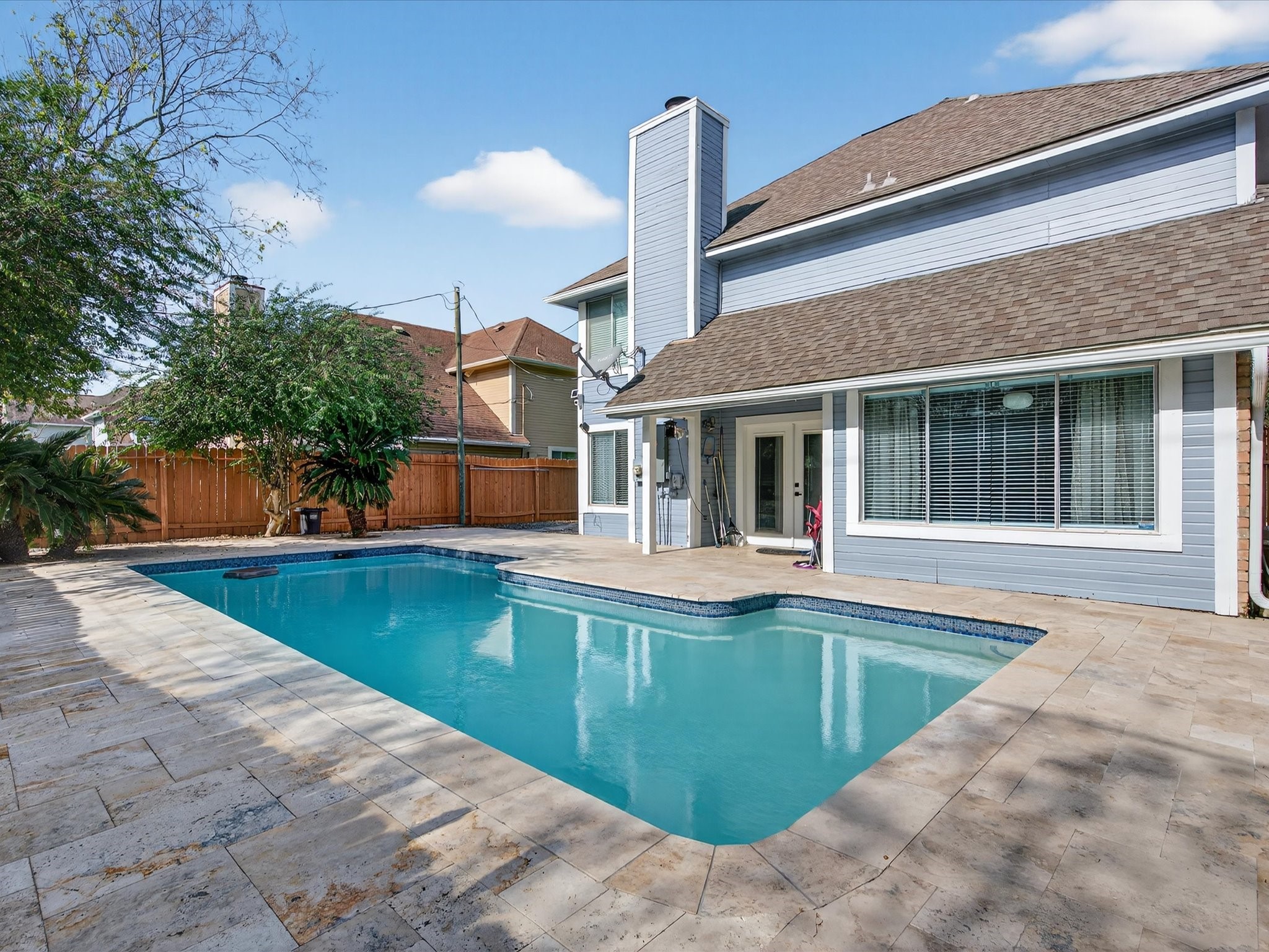 1676 Beaconshire Houston, TX 77077 - Photo 15 of 28 a house view with swimming pool in front of it