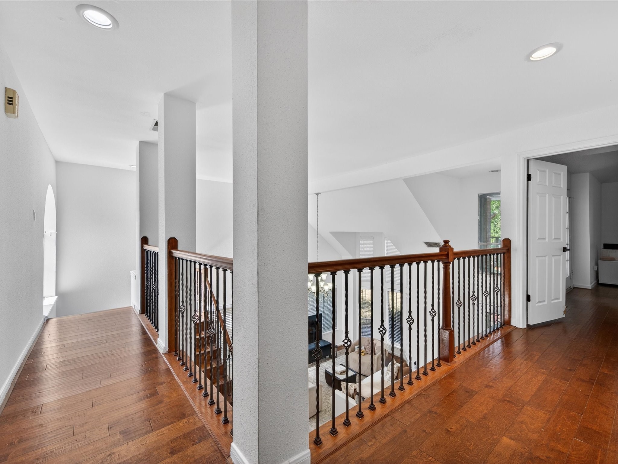 1676 Beaconshire Houston, TX 77077 - Photo 18 of 28 a view of a hallway with wooden floor and entryway