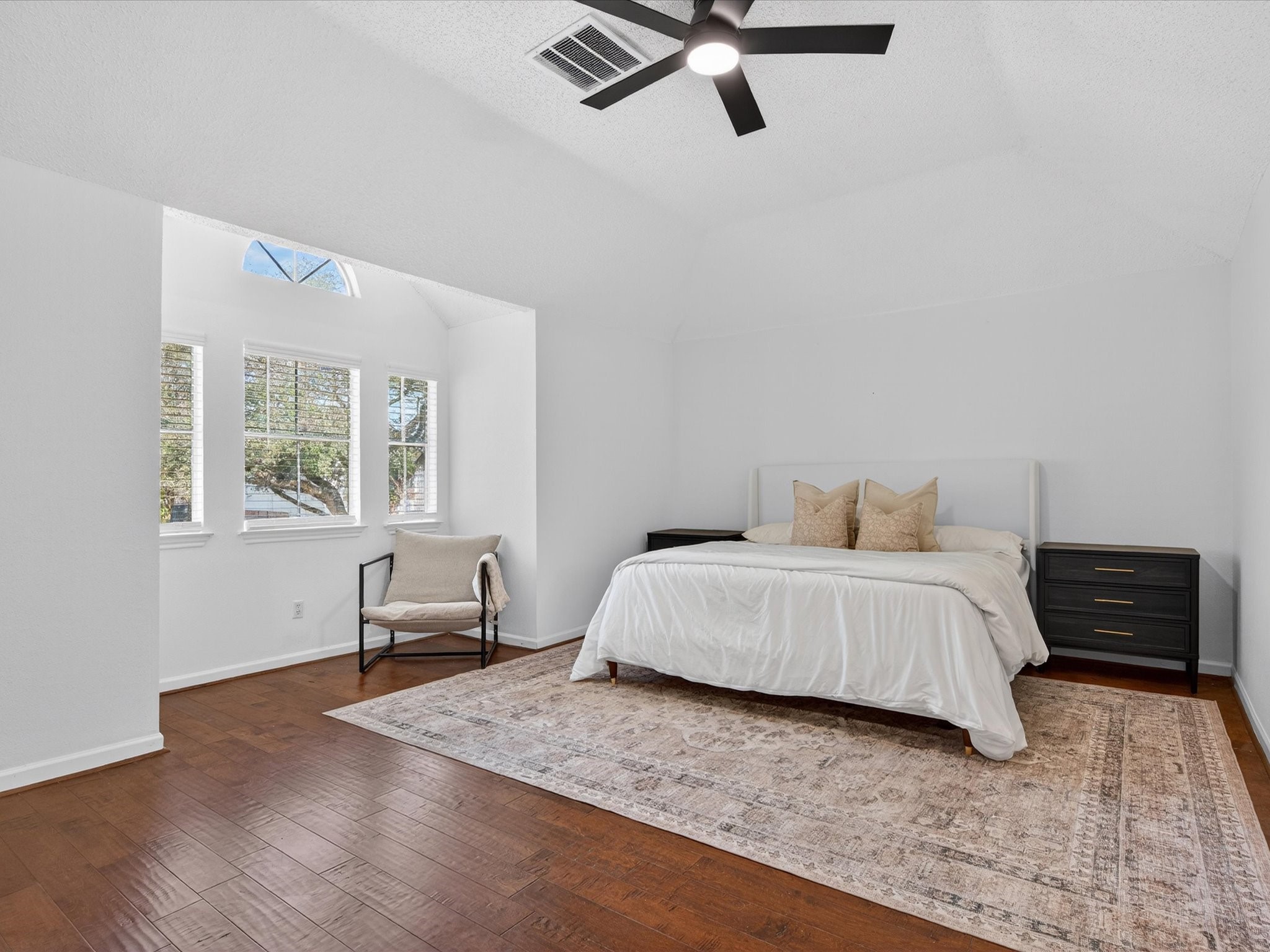 1676 Beaconshire Houston, TX 77077 - Photo 19 of 28 a bedroom with a bed and wooden floor