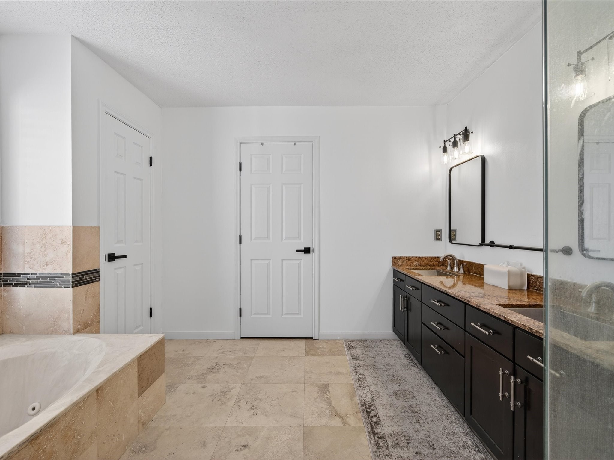 1676 Beaconshire Houston, TX 77077 - Photo 20 of 28 a bathroom with double vanity sink and a mirror