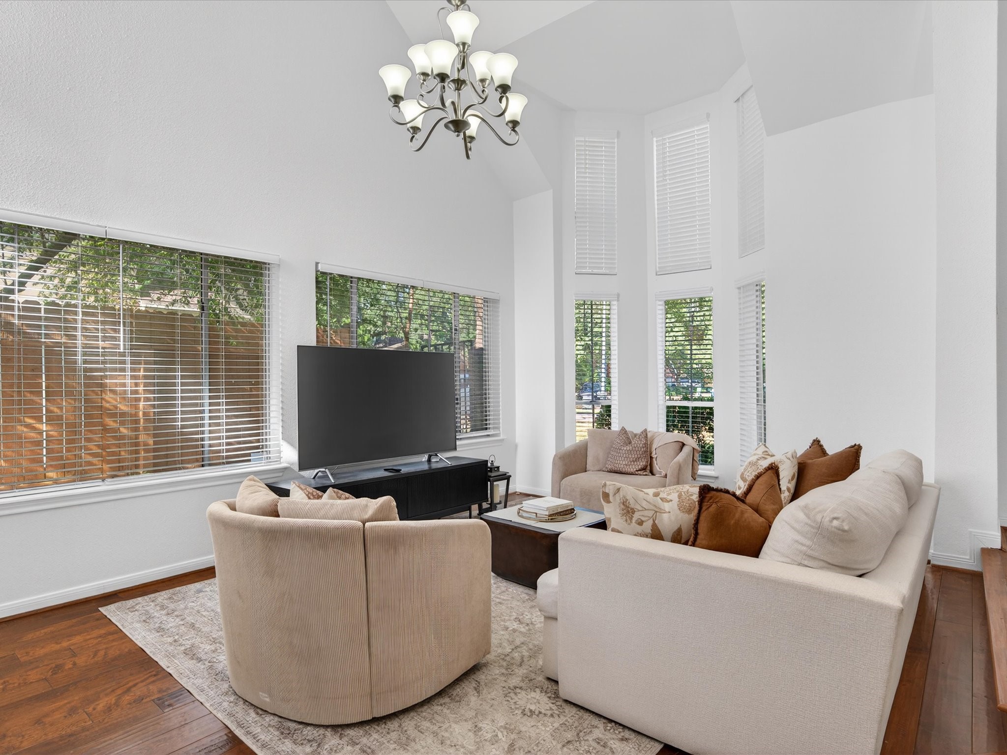 1676 Beaconshire Houston, TX 77077 - Photo 5 of 28 a living room with furniture potted plant and a large window