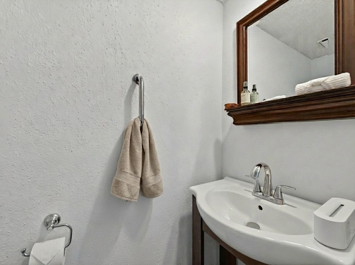 1676 Beaconshire Houston, TX 77077 - Photo 6 of 28 a bathroom with a sink and a mirror