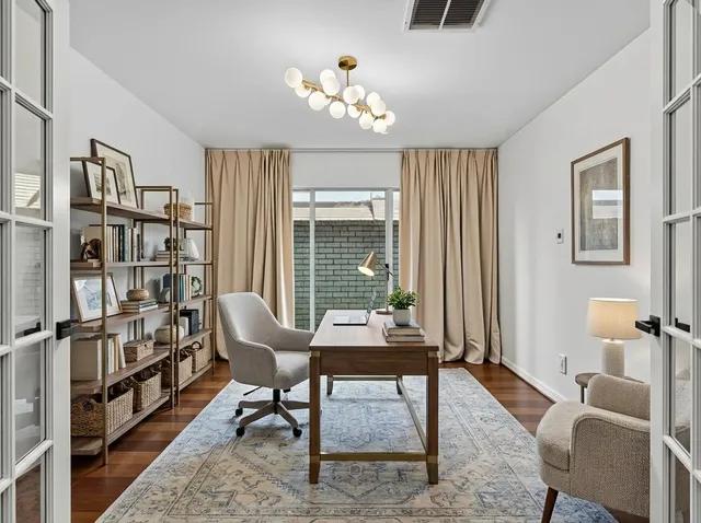 a living room with furniture or window and a potted plant