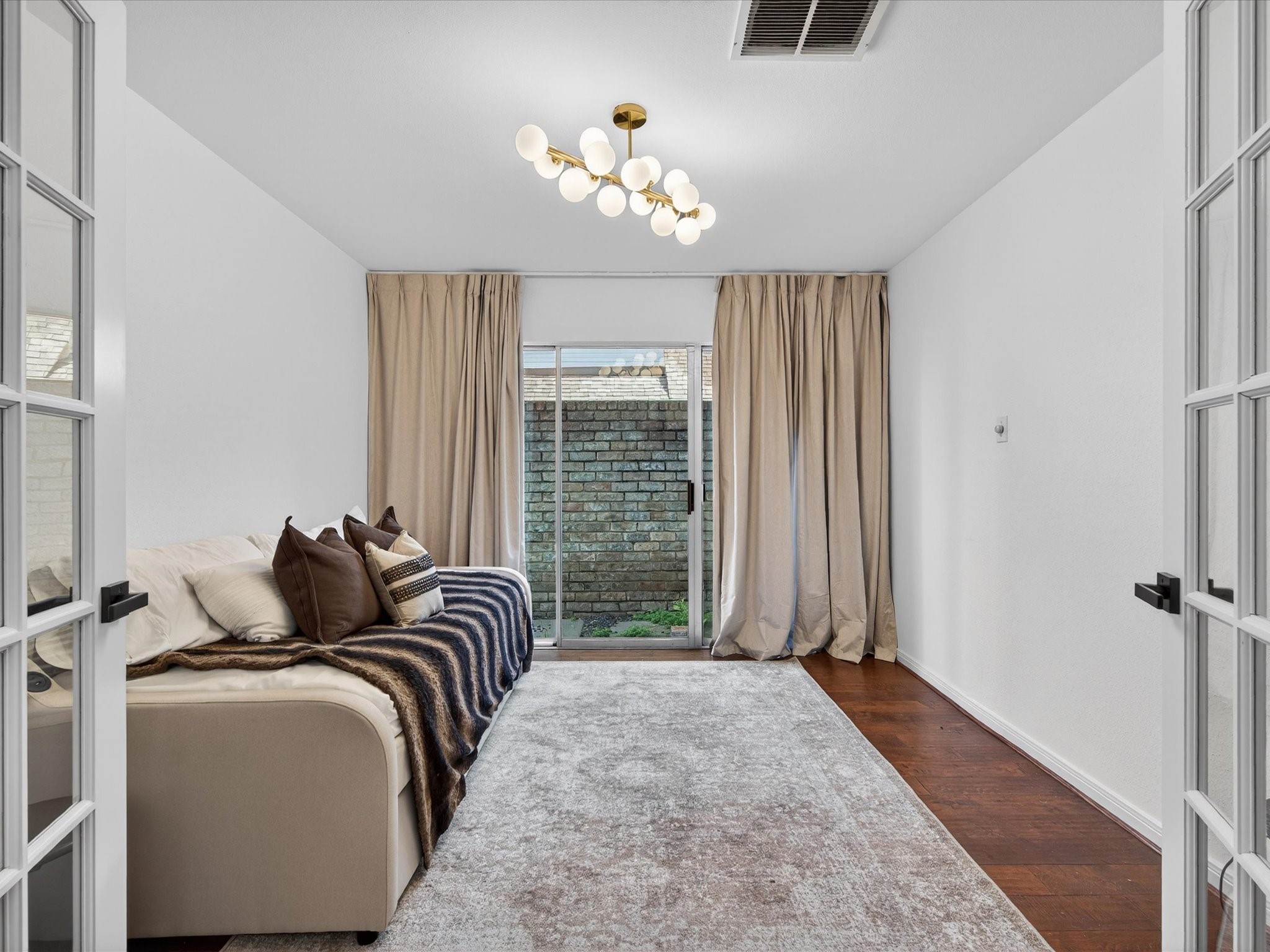 1676 Beaconshire Houston, TX 77077 - Photo 7 of 28 a bedroom with bed and a window