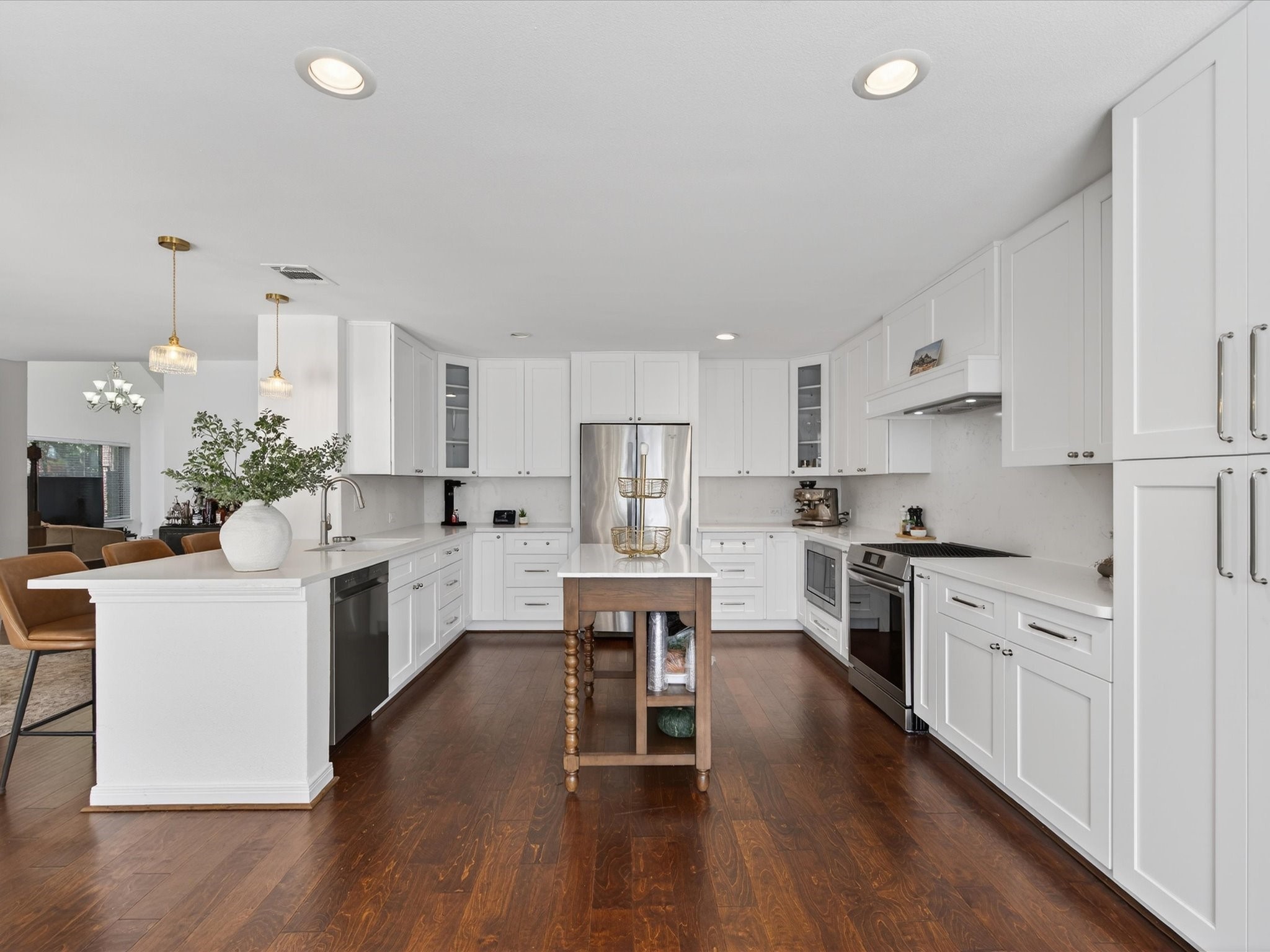1676 Beaconshire Houston, TX 77077 - Photo 9 of 28 a kitchen with white cabinets and white appliances