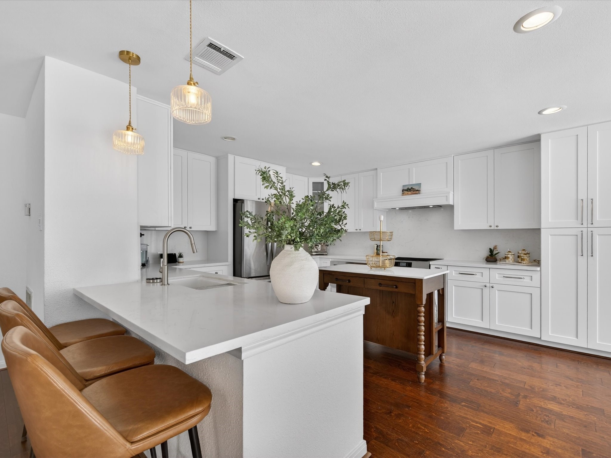 1676 Beaconshire Houston, TX 77077 - Photo 10 of 28 a kitchen with a table and chairs in it
