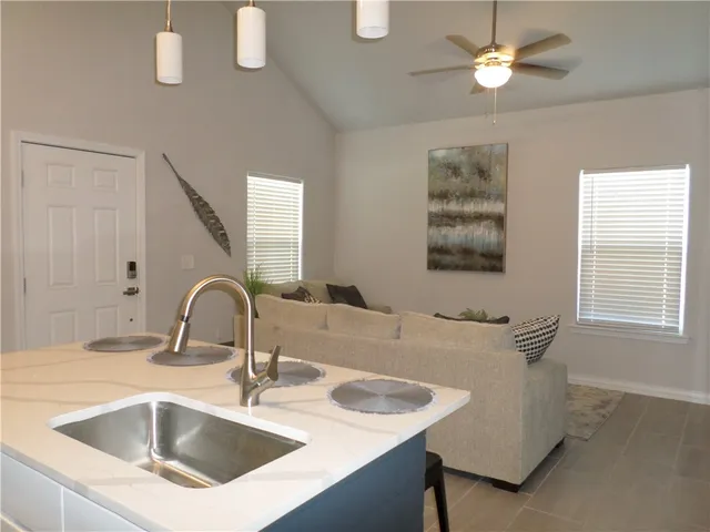 a close view of a sink and a faucet in the room