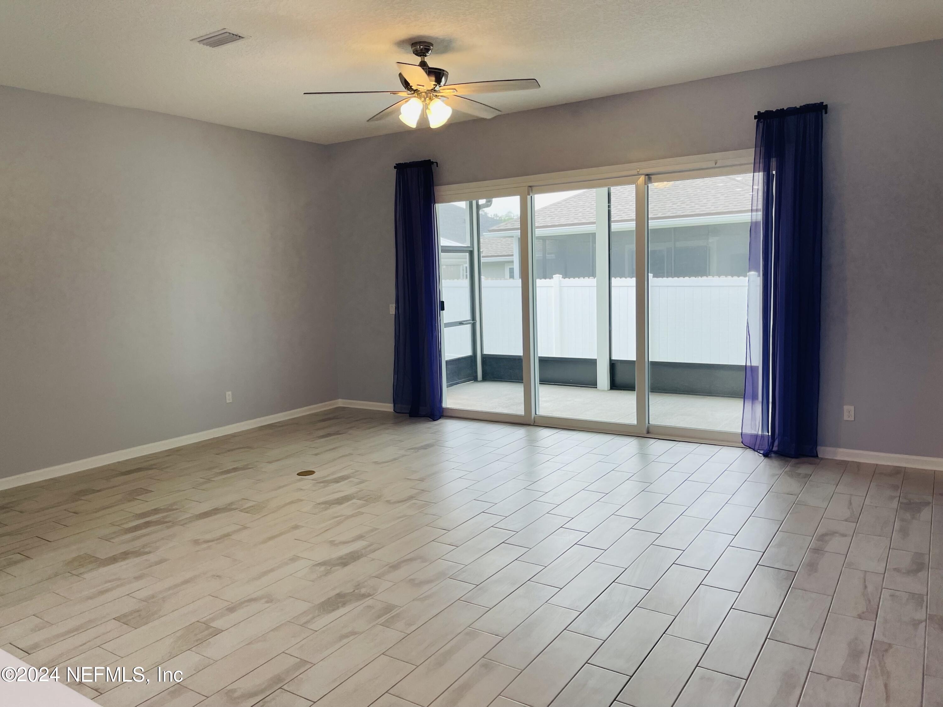 86508 Secluded Place Yulee, FL 32097 - Photo 13 of 43 a view of an empty room with a window