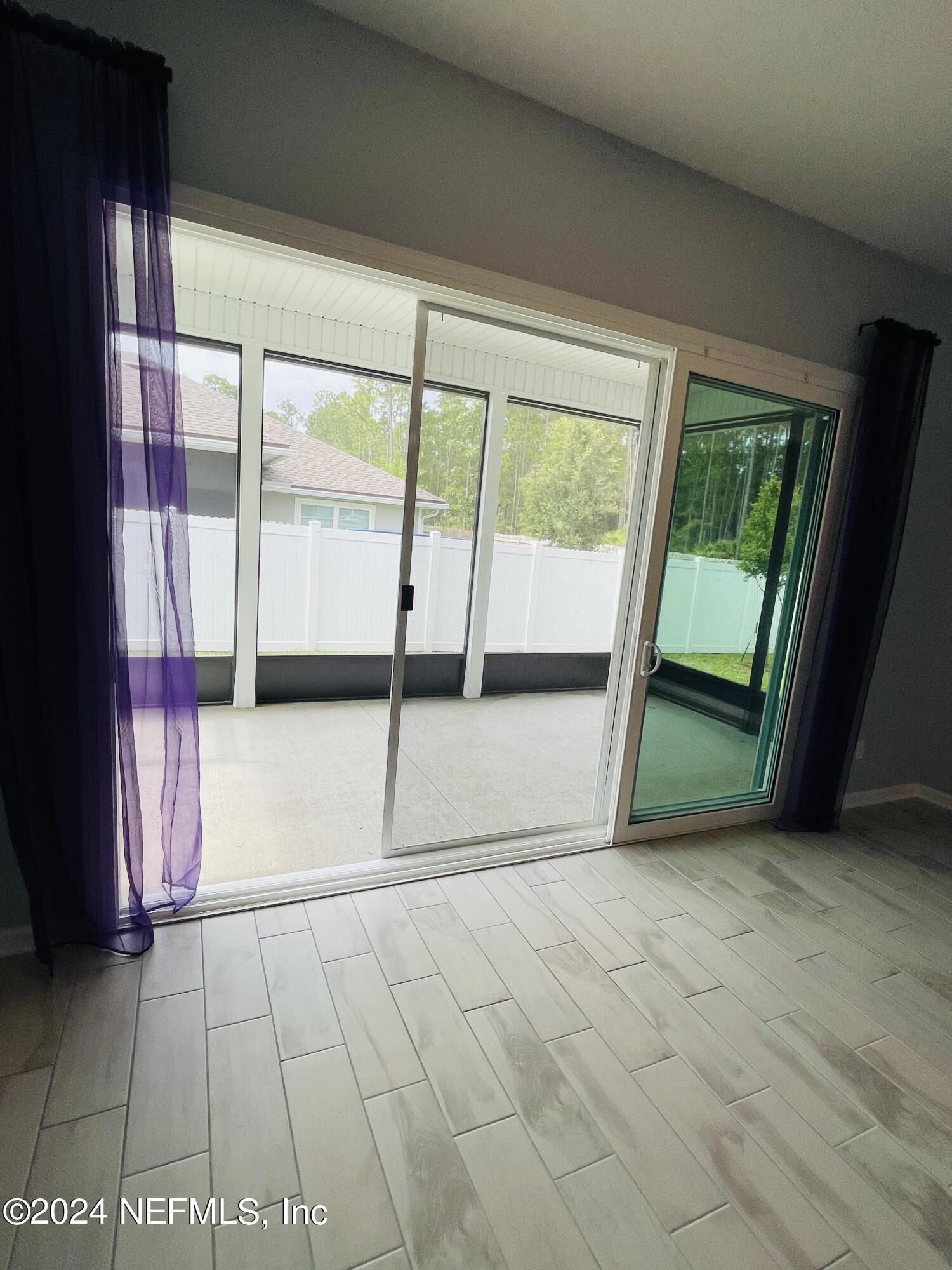 86508 Secluded Place Yulee, FL 32097 - Photo 15 of 43 a view of an empty room with a window