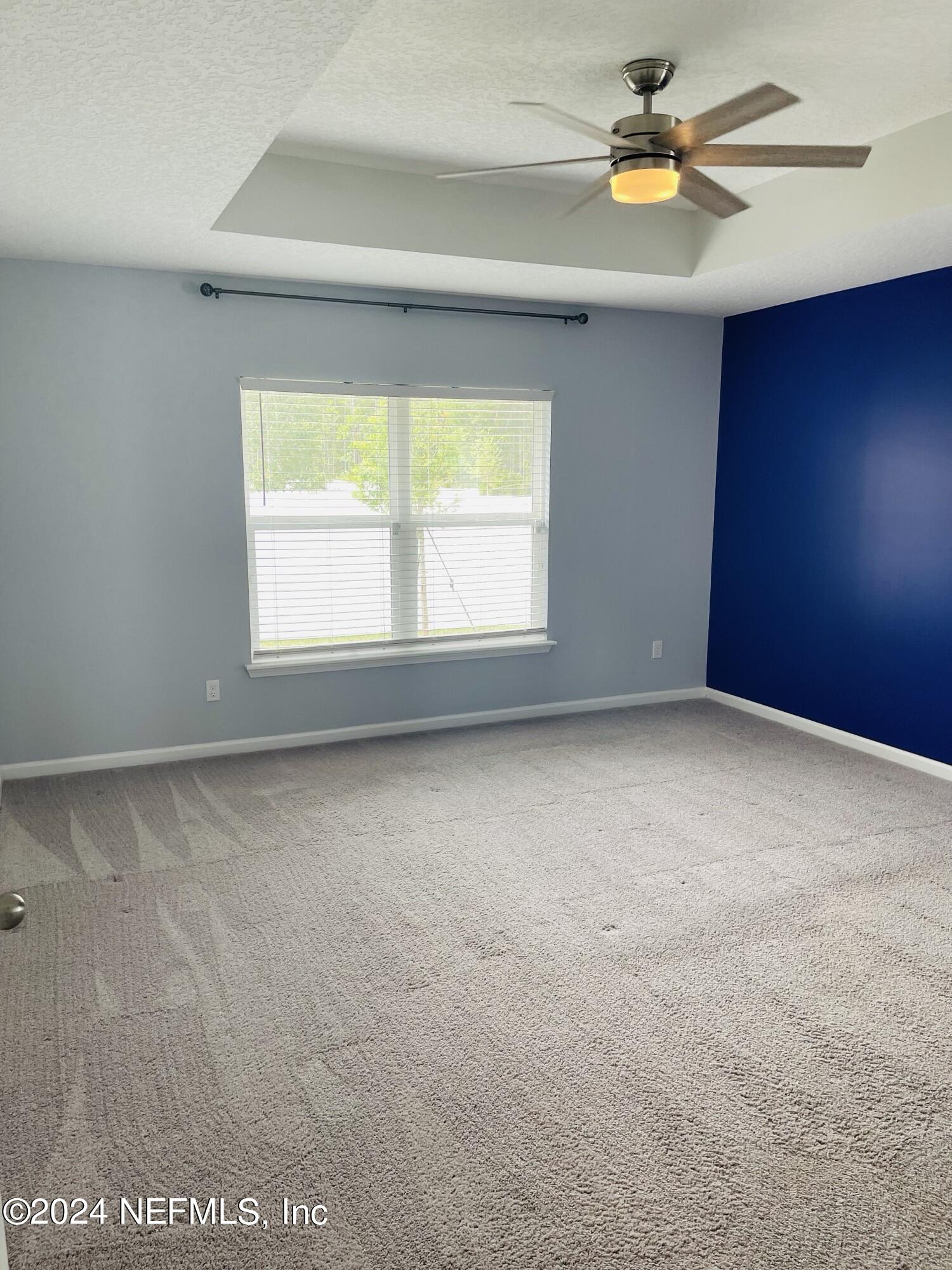 86508 Secluded Place Yulee, FL 32097 - Photo 17 of 43 an empty room with a window