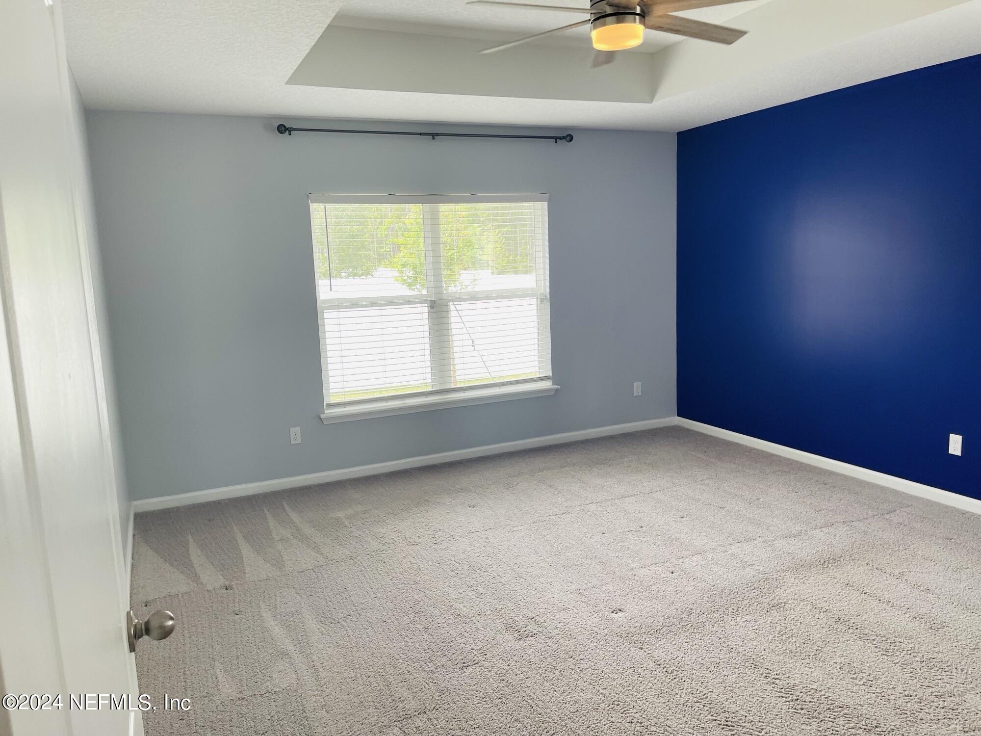 86508 Secluded Place Yulee, FL 32097 - Photo 18 of 43 an empty room with a window