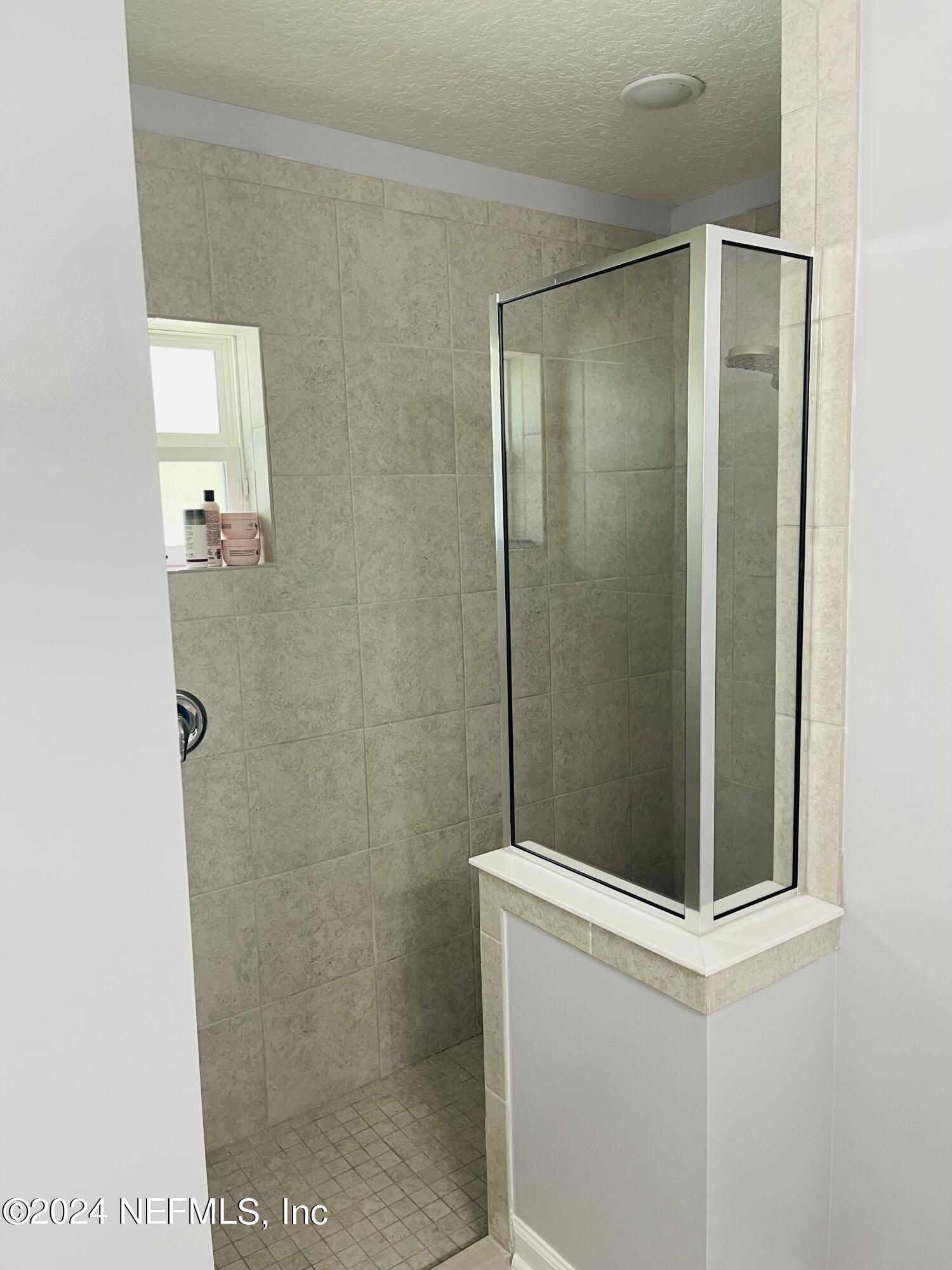 86508 Secluded Place Yulee, FL 32097 - Photo 19 of 43 a bathroom with a shower