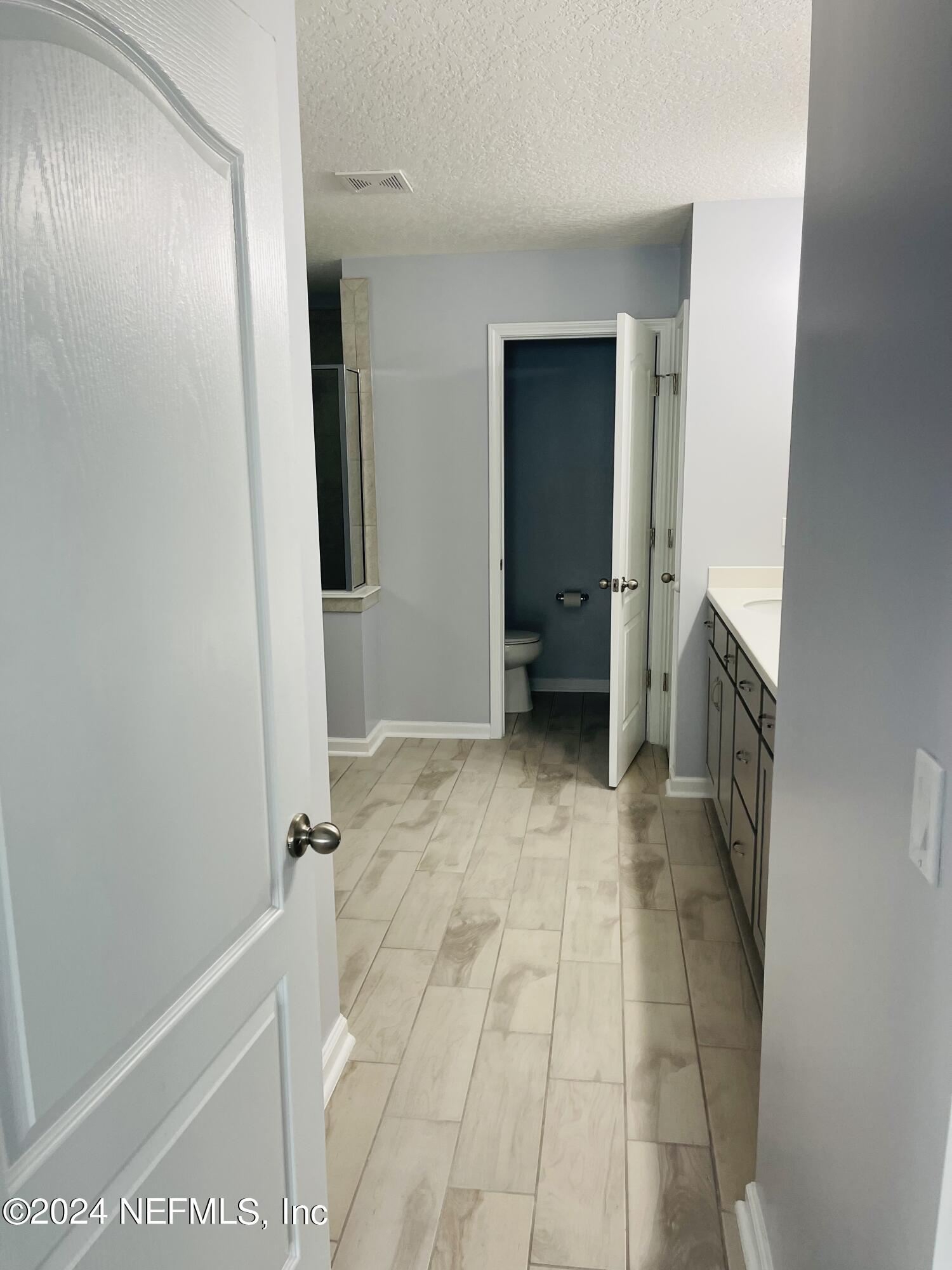 86508 Secluded Place Yulee, FL 32097 - Photo 20 of 43 a view of a hallway to rooms