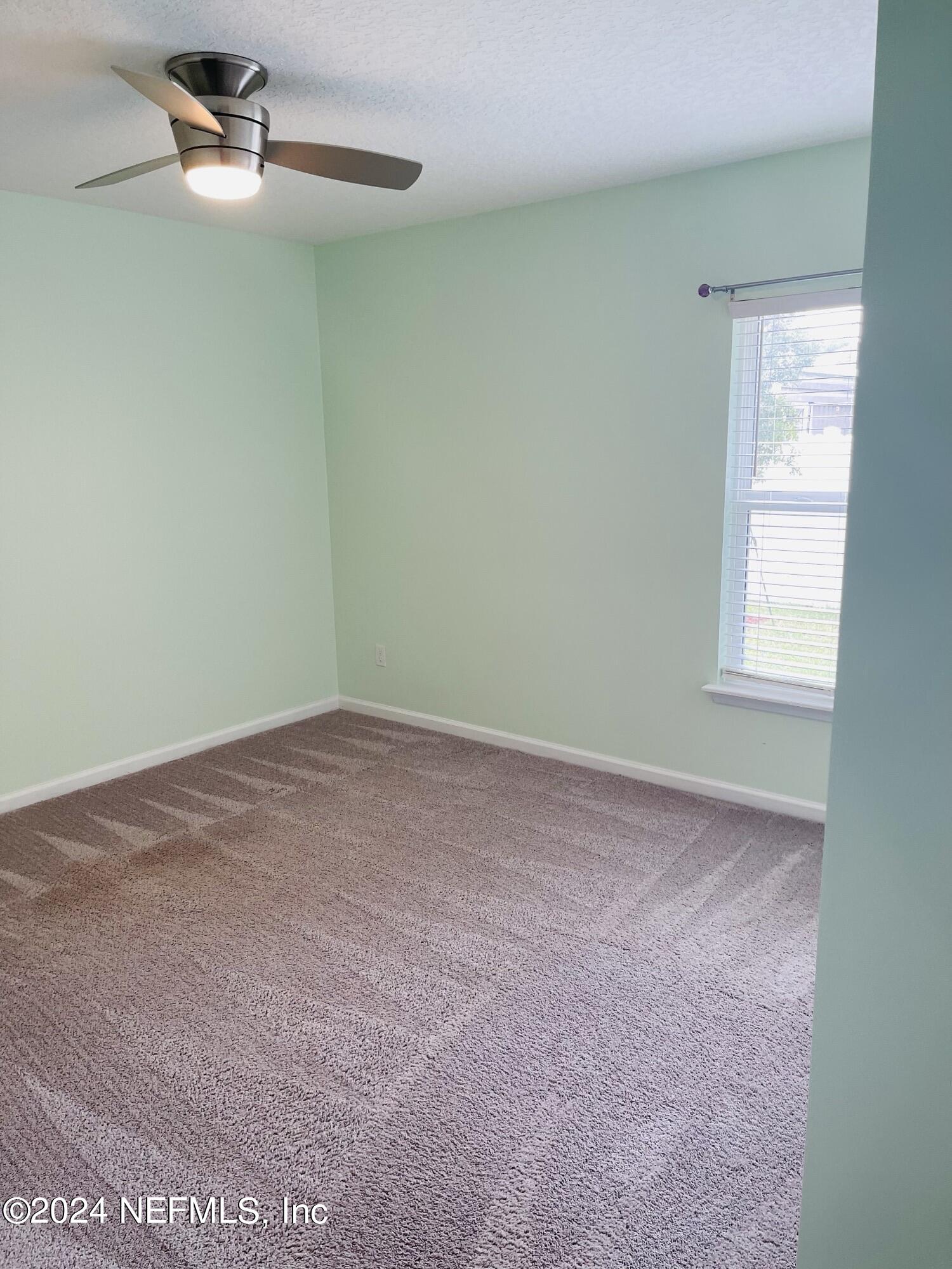 86508 Secluded Place Yulee, FL 32097 - Photo 26 of 43 an empty room with windows
