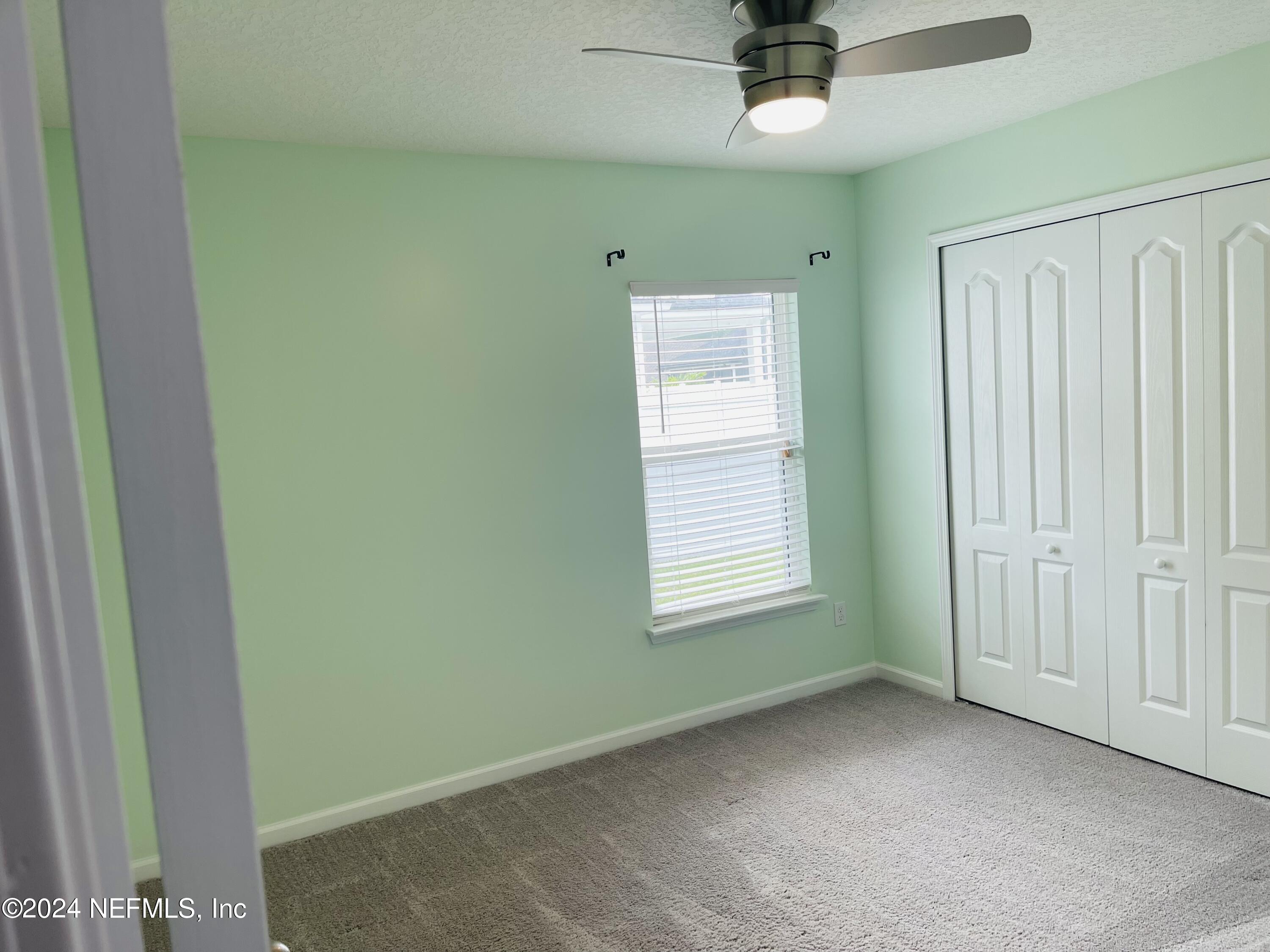 86508 Secluded Place Yulee, FL 32097 - Photo 29 of 43 a view of an empty room with a window