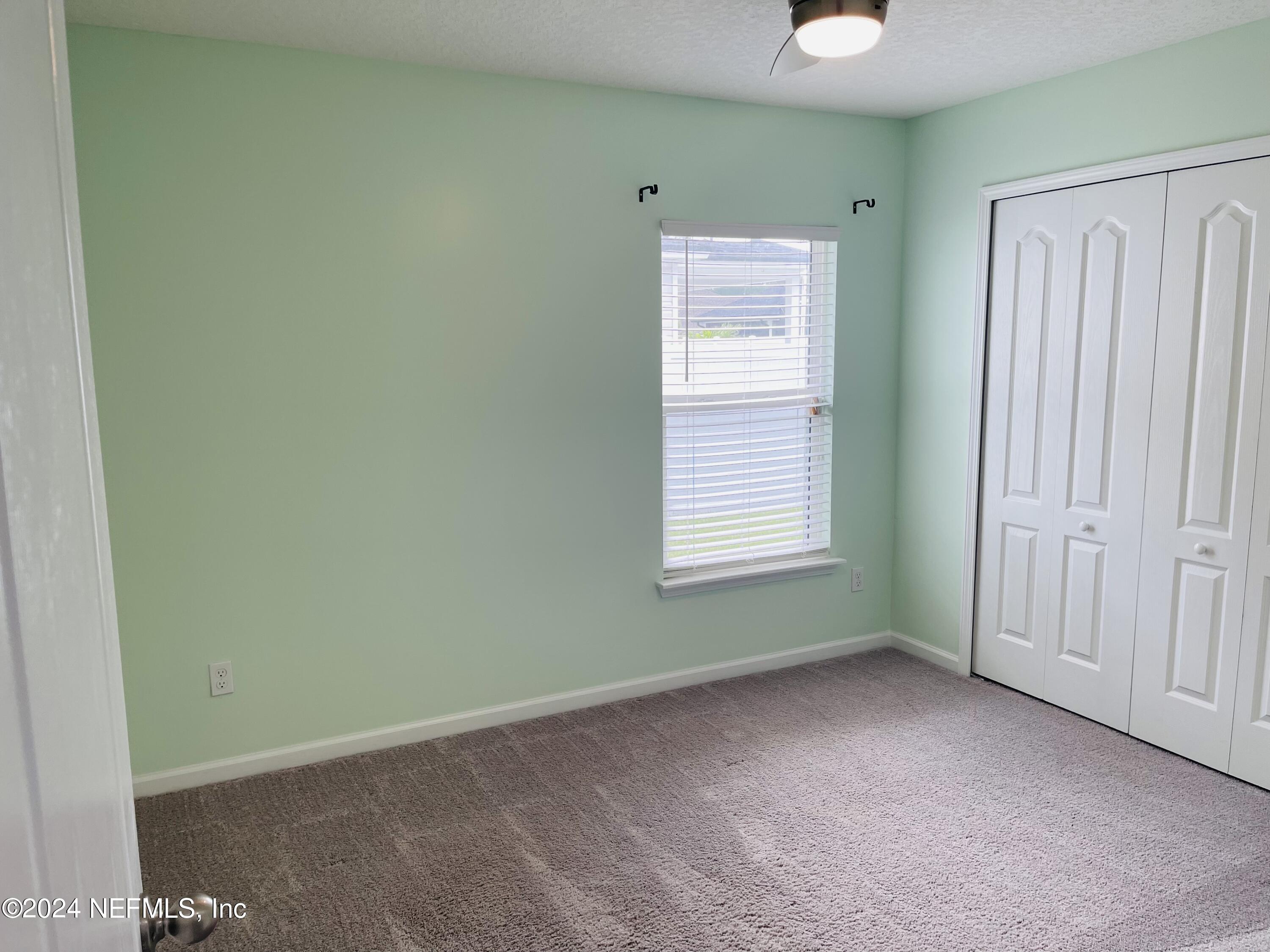 86508 Secluded Place Yulee, FL 32097 - Photo 30 of 43 an empty room with windows